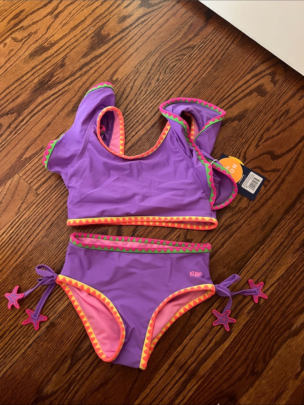 Ruffle Butts Purple Girls Two-Piece Swim Set with Pink & Orange Trim